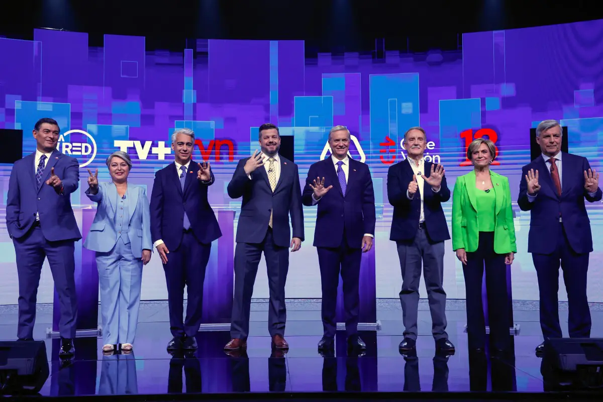 Los candidatos luego del último debate/AFP